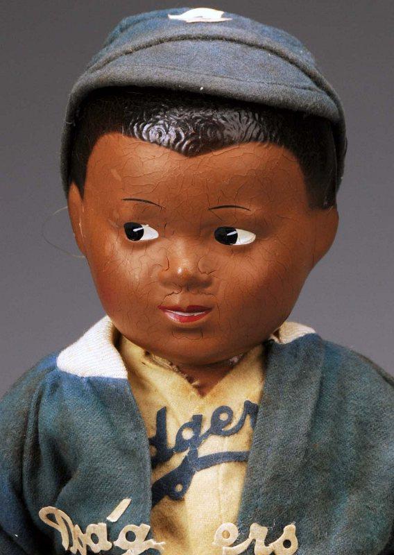 Allied-Grand Jackie Robinson Baseball Player.: American, Ca. 1940s. All composition (fine overall crazing) with black molded and painted hair, dark side glancing eyes, closed mouth with painted teeth, jointed neck, shoulders and hips. All original