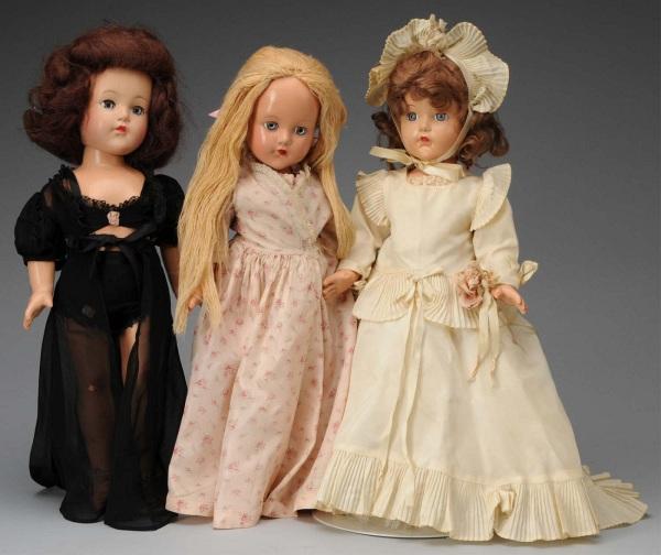 Lot of 3: Effanbee "Little Lady" Dolls.: American, Ca. 1940s. All composition. 1 with blonde yarn hair, clear lashed blue sleeping eyes, all original in panties, shorties, robe and slippers (light overall crazing). 1 with brown mohair wig, l