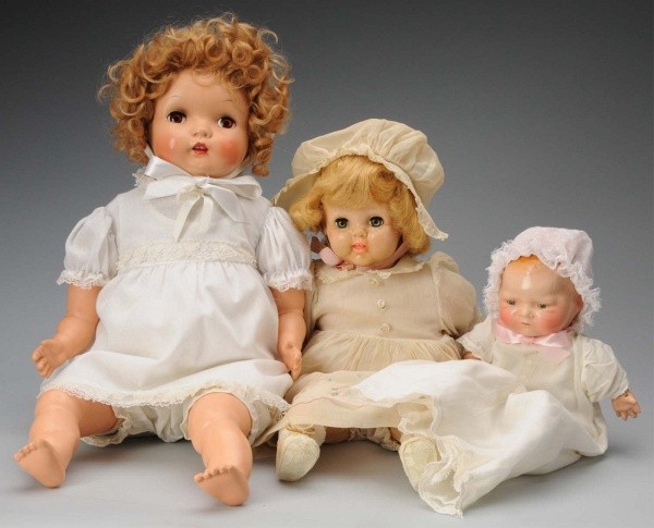 Lot of 3: American Baby Dolls.: Arranbee, 1920s "Baby Petite," with molded and painted hair, tin sleeping eyes, rosy cheeks, closed mouth, cloth body with composition hands (worn fingers), vintage baby gown; Madame Alexander 1951 ea