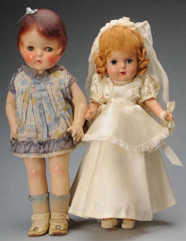 Lot of 2: Composition Dolls.: American, Ca. 1930-1940. Girl with dark red molded hair, clear blue lashed sleeping eyes, rosy cheeks, closed mouth, cloth body, composition arms and legs, all original dress (soil spot in front, also