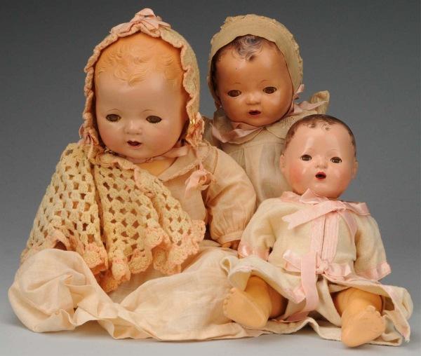 Lot of 3: Effanbee "Dy-Dee Babies.: American, Ca. 1930-1940. Baby with molded hair and ears, sleeping eyes (crackled), rubber body, tagged F & B baby gown, hat and slip, undies and socks with additional clothes and accessories: tagged g
