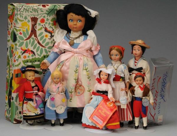 Lot of 7: Lenci Dolls.: , Ca. 1950s. Flocked hard plastic dark-skinned girl with parchment tag "Abruzzo" with original box; 5 hard plastic girls in various Italian regional costumes with labels and one Venice gondolier. Larg
