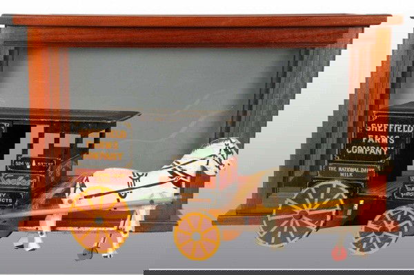Wooden Sheffield Farms Horse-Drawn Milk Wagon Toy: Nicely detailed back marked "Sealtest Dairy Products" and with an address in New York City. Wagon is pulled by one horse with jointed legs. Some edge wear to back cart and a few scratches to horse's n