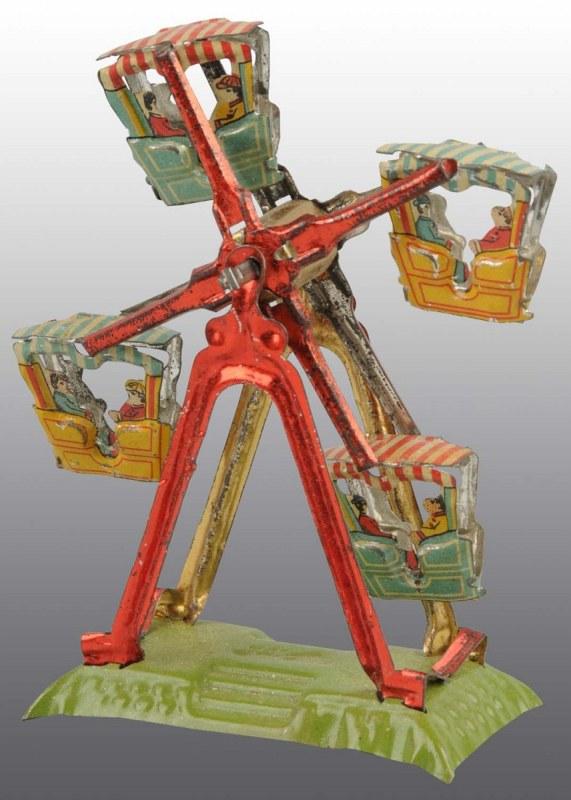 Tin Litho Ferris Wheel Penny Toy.: German. Working. Scarce. Depicts two people in each carnival cart that spin around base when crank is turned. One of the most desirable penny toys with one of the best actions. Minimal wear overall. 3