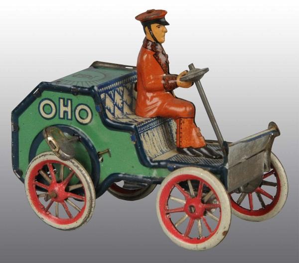 Tin Litho Lehmann Oho Car Wind-Up Toy: German. Working. Tin litho driver. Minor wear to wheels. 4" L. (Excellent).