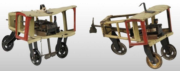 Lot of 2: Tin Litho Bi-Wing Airplane Wind-Up Toys: German. Possibly made by Fisher. Both are identical planes with tin litho pilots and missing their propellers. One toy is also missing the propeller attachment. One toy is working and one is overwound