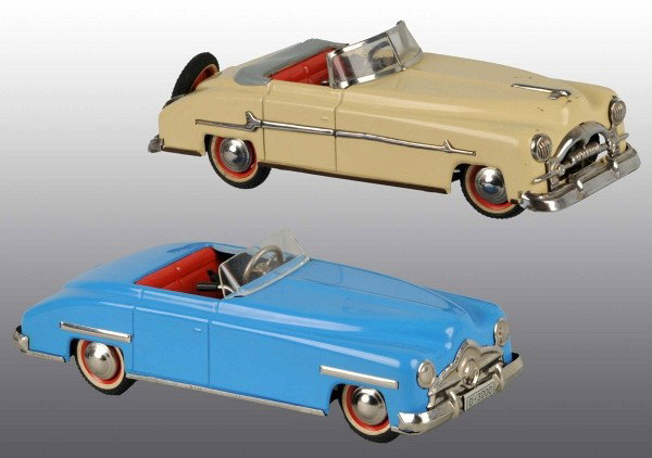 Lot of 2: Tin Arnold Automobile Wind-Up Toys.: German. Working. Marked "US Zone Germany". One with broken post on windshield. Some small paint chipping throughout. Each: 10" L. (Very Good - Excellent).