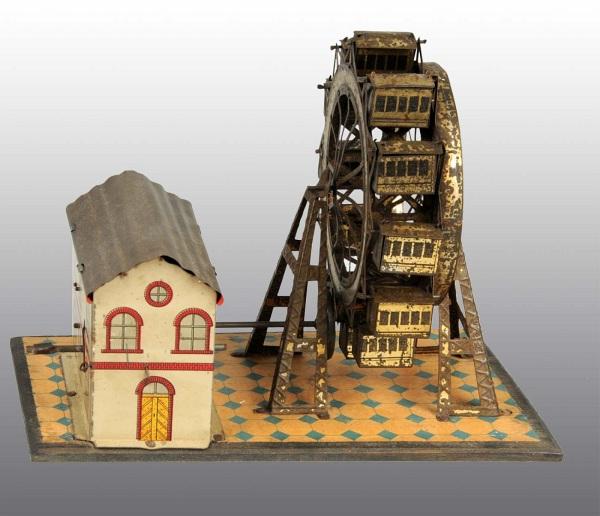 Tin Litho Ferris Wheel Wind-Up Toy.: German. Working but needs adjustment to spin ferris wheel. Combination of tin litho and japanning. Gold washing to wheel and supports is worn. 6" T. (Very Good).