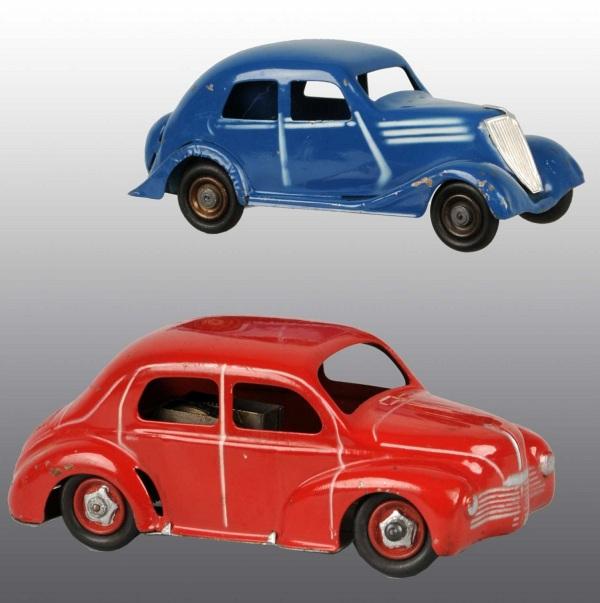 Lot of 2: Tin Renault Automobile Wind-Up Toys.: French. Working. Some minor chipping and wear throughout. Largest: 7" L. (Very Good).
