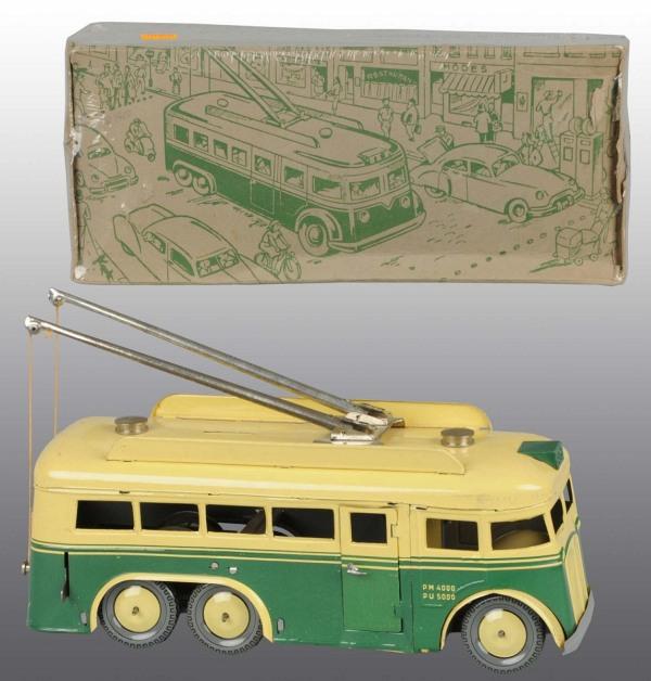 Tin Litho Trolley-Bus Wind-Up Toy.: French. Circa 1953. Working. Made by Joustra. Bus has opening doors and original trolley pulls. Very little wear overall. Includes original box with interesting Parisian street scene. 12" L. (Excellen