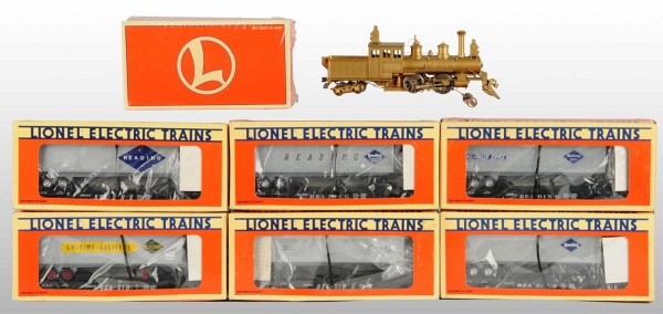 Lot of 8: Lionel Train Engine & Cars.: American. Includes six, circa 1996, Lionel contemporary Silver Anniversary Hamburg-Dutch Train cars all in original boxes. Also includes no. 6486 Ore car sealed in original box and brass Japanese engi