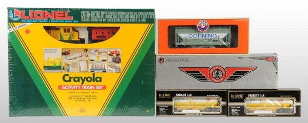 Lot of 5: Lionel & K-Line Train Items.: American. Includes no. 8951 Southern Pacific Fairbanks Morse train engine, one contemporary Crayola Activity Train Set, two K-Line freight cars, and one contemporary Corning hopper car. Includes all o