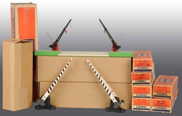 Lot of 10: Lionel Accessory Items.: American. Post-war. Includes seven no. 252 Automatic Crossing Gates, six in original boxes, one no. 47 Automatic Crossing Gate in original box, and two no. 152 Crossing Gates in reproduction boxes. So