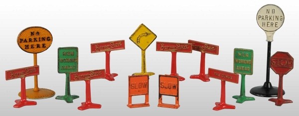 Lot of 14: Cast Iron Road Sign Toys.: American. Includes six scarce Burma Shave and other various parking and stop signs. Some chipping and wear. Largest: 6 - 1/2" T. (Very Good - Excellent).