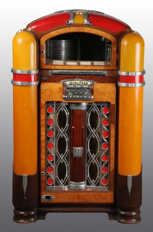 1941 Wurlitzer Model 800 Jukebox.: Appears original and includes Catalin Plastics but untested. Case is empty. Entire motor mechanism is missing. Crack in upper right amber panel and in red panel. (Very Good).