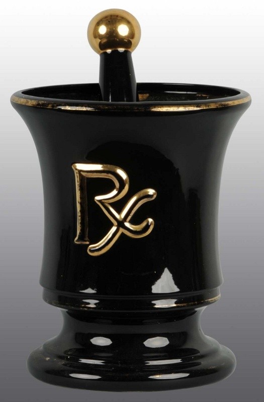 Large Black & Gold RX Mortar and Pestle.: Made by Gilman Brothers in Boston, MA. Classic display item made of vitreous china. Still retains a good percentage of the gold leaf banding and highlights. Medium soiling throughout. Mortar: 14 - 3/4