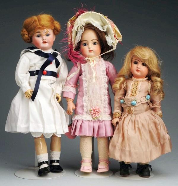 Lot of 3: French Bisque Dolls.: Unmarked head, probably Limoges, glass eyes, open mouth, jointed composition body (repainted); Tête Jumeau (fully repaired and repainted head)), brown paperweight eyes, closed mouth, Jumeau stamped F