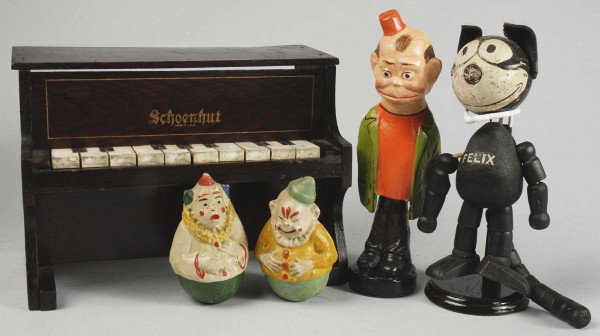 Lot of Schoenhut and Character Dolls.: Schoenhut "Felix" with label on foot (lots of face wear), all segmented wood body, leather ears; "Happy Hooligan" papier-mâché bobbing doll, 2 small Schoenhut Roly-Poly clowns, Schoenhut wood piano 