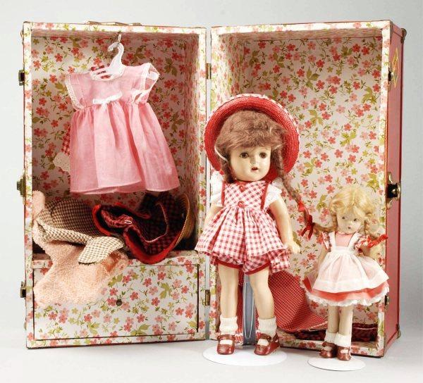 Lot of 2 American Dolls in Wardrobe Trunk.: Unmarked composition doll à la McGuffey Ana with brown mohair braids, lashed brown sleeping eyes, open mouth with teeth, all original in red check dress, red straw hat, red shoes and socks. With a wa