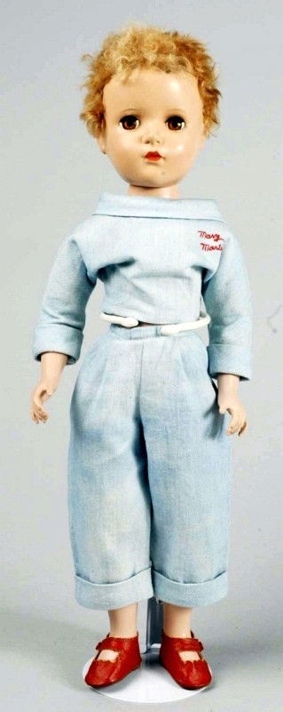 Rare Madame Alexander Hard Plastic "Mary Martin".: From the movie and show "South Pacific." Original blonde caracul wig, lashed brown sleeping eyes, closed mouth, pink cheeks. Original tagged 'Mary Martin South Pacific" denim outfit (a little faded),