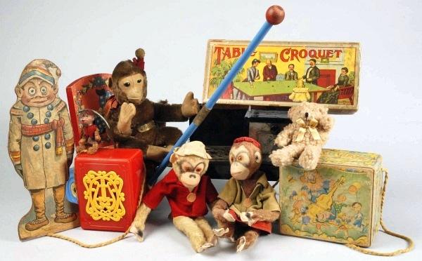 Lot of Toys.: Plush monkey named "Kaysee" in a wooden pull toy with metal wheels by The Gong Bell Manufacturing Co. Hurdy Gurdy Organ Grinder with two plush monkeys, having armature bodies, glass eyes and original