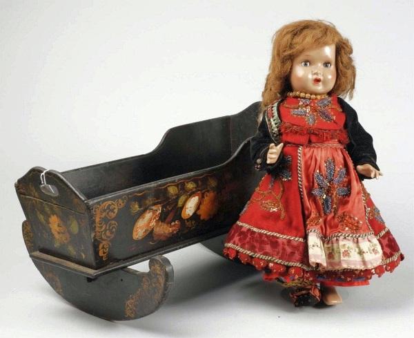 Doll, Cradle, & Accessories.: Black painted wood cradle 20 x 9" with hand-painted flower decorations on side (end board broken and nailed), European composition doll with real hair wig, sleeping eyes, and very elaborate eastern Eu