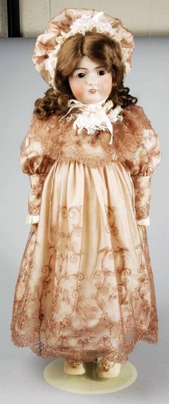 Large Bruno Schmidt German Bisque Child Doll.: Incised on back of head BSW in Heart, bisque socket head (cheek rubs), brown set eyes (new), no upper eyelashes, open mouth with teeth, jointed composition body (repainted), luxurious silk and lace dr