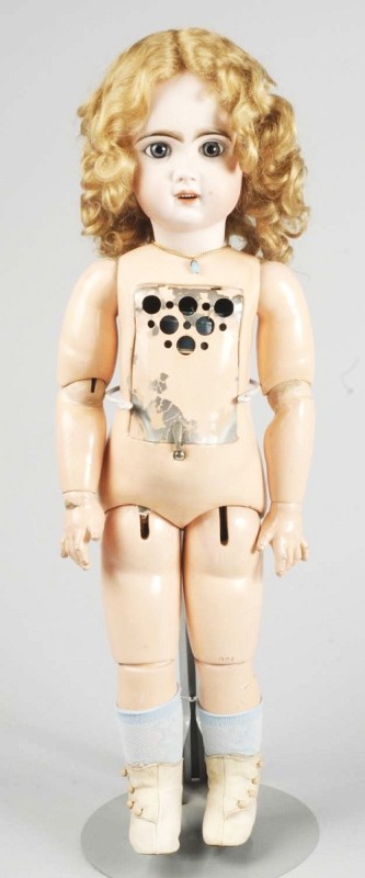 French Bisque Jumeau "Bébé Phonographe" Doll.: Bisque socket head with red stamp "Tête Jumeau," blue paperweight eyes, painted upper and lower eyelashes, dark multi-stroked eyebrows, open mouth with 6 upper teeth, pierced ears, cork pate, replace