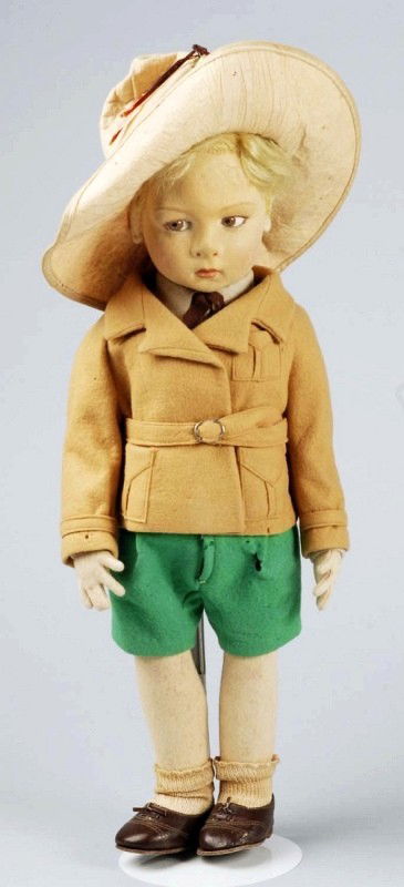 Felt Lenci Character Boy Doll.: Appealing pouty face (flat spot on head, some soil, light moth damage on neck), brown side-glancing eyes, painted upper eyelashes, applied ears, blonde mohair wig, original brown felt jacket with pock