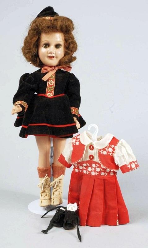 Lovely Ideal Teenage Star "Deanna Durbin".: All composition (crazing on legs), original brown human hair wig, dark eye shadow, lashed sleeping eyes (crackled), open mouth with upper teeth. Wearing vintage black velvet skating outfit with matchi