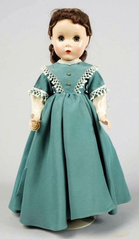 Madame Alexander Hard Plastic "Little Women" Doll: All hard plastic with Maggie face, brown dynel hair in original set with ribbon, lashed sleeping eyes, rosy cheeks, closed mouth, Totally factory original in tagged "Jo" green gown with undies, shoes 