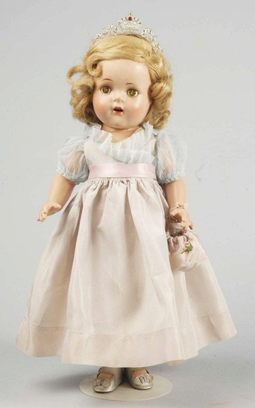Lovely Madame Alexander "Princess Elizabeth" Doll: All composition (several eye cracks), original blonde human hair wig, gray eye shadow, lashed sleeping eyes (crackled), open mouth with upper teeth. Totally all factory original in tagged (tag writing