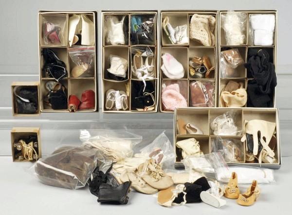 Large Lot of Doll Shoes.: 32 pairs of doll shoes, a mixture of vintage and new; 15 pairs of socks, and pair of antique brown leather high-top child's shoes. (Good - Excellent).