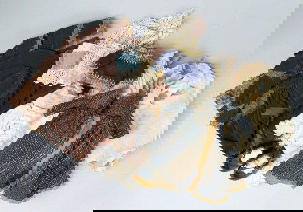 Large Lot of Vintage and Antique Doll Clothes.: Antique woven wool coat; 3 bags of child made cotton skirts and blouses for dolls ranging from about 6 to 10-12" doll (this is a large lot of clothes); 2 crocheted baby sweaters; baby hat; other cloth