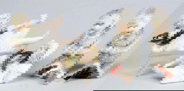 Lot of 4 German Bisque "Snow" Figurines.: All are unmarked but lovely quality, with lovely modeling details and beautiful facial painting. Boy and Girl pair with gray "snow" coats and hats, Boy and Girl pair lying down with white "snow" shift