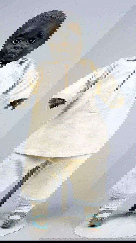 Rare & Desirable Black Character Doll by Leo Moss: Leo Moss was a black American folk doll artist, untrained, from Macon, Ga., who worked in the early 1900s. It is speculated that he made fewer than 100 dolls. All were individually sculpted from papie