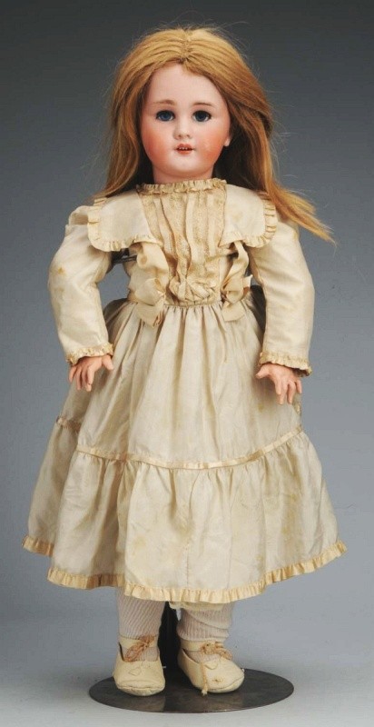 French Bisque Bébé Doll.: DEP (Jumeau), replaced eyes, molded eyebrows, open mouth with teeth, pierced ears, French jointed composition and wood body (repainted hands), cream sill dress looks vintage. 24" T. (Excellent).