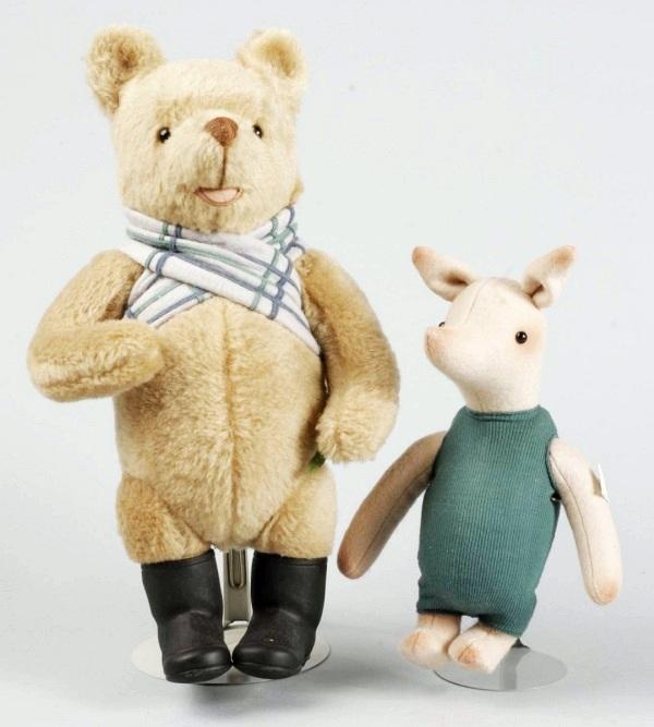 R. John Wright "Winnie-the-Pooh" Characters.: Holiday Pooh" made exclusively for the Walt Disney World Doll & Teddy Bear Convention, 1997, #985/1000. "Life-Size Piglet" #672/1000, all felt with glass eyes, wearing original knit suit, 1987. No box