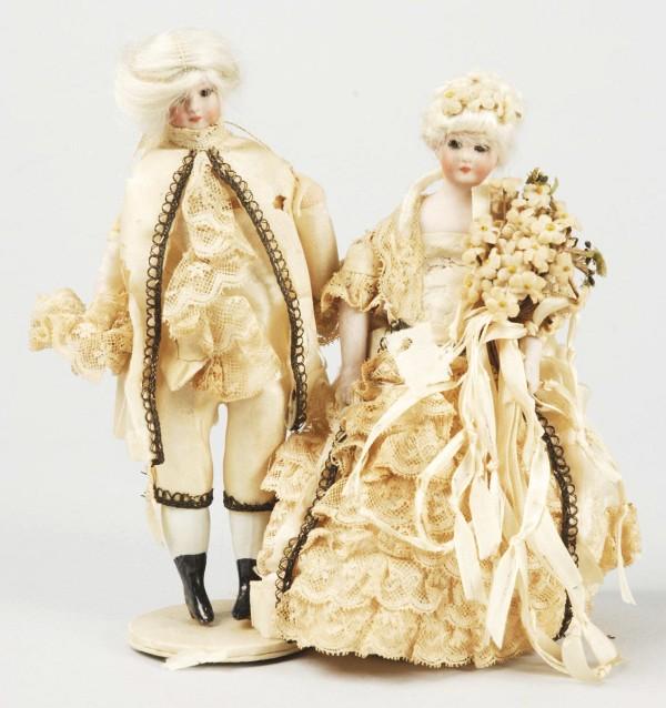 Lovely Pair of German Bisque Doll House Dolls.: Both with Simon & Halbig 1160 shoulder heads, so-called Little Women mold, with glass eyes, closed mouths and mohair wigs. Man has a cloth body with bisque lower limbs. Lady has a "cone" lower body wi