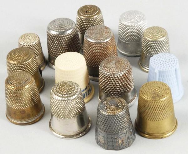 Lot of 14: Metal & Plastic Thimbles.: Several have advertising, some are sterling, and others are brass. Size: Largest: 3/4" L.