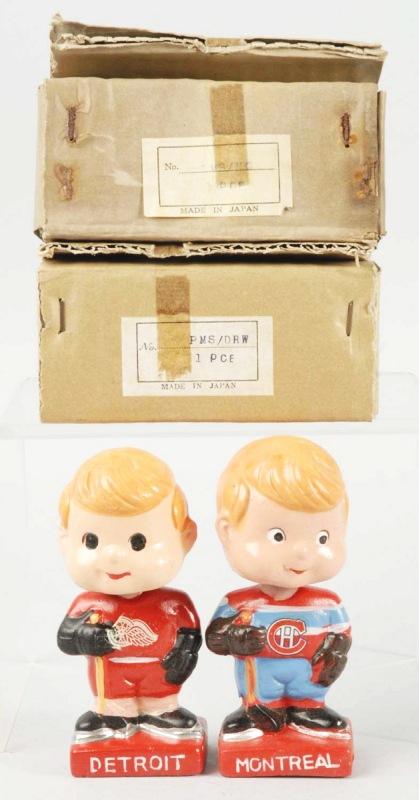 Lot of 2: Composition Hockey Bobble Head Dolls.: Japanese. Includes Montreal Canadians and Detroit Red Wings. Both are old store stock in their original boxes and cardboard inserts. Size: Each: 4 - 3/4" T.