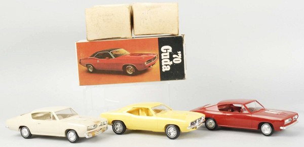 Lot of 3: Barracuda Promotional Muscle Car Toys.: Includes two 1967 hardtops and one 1970 lemon twist Hemi with decals that have not been applied to toy. Includes all original boxes, two with overall creasing. Size: Each: 9" L.