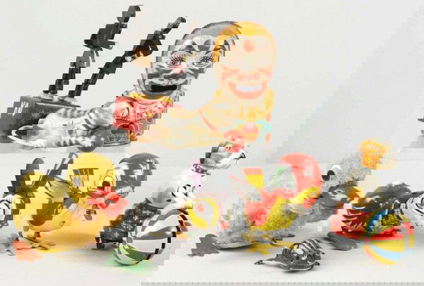 Lot of 7: Miscellaneous Tin & Wooden Toys.: Includes five animal toys, two of which are contemporary, one Chein clown bank, and one wooden Boxer toy, which is probably Canadian. Size: Largest: 8" L.