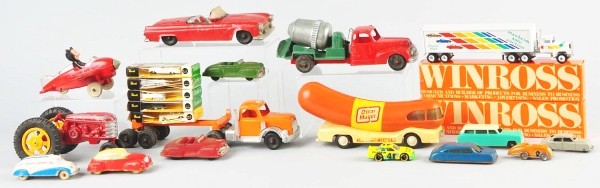 Lot of Assorted Toys.: American. Includes Auburn rubber Mickey Mouse airplane with missing props, plastic and rubber cars by Auburn, two trucks in original boxes, and other assorted items. Size: Largest: 9 - 1/2" L.