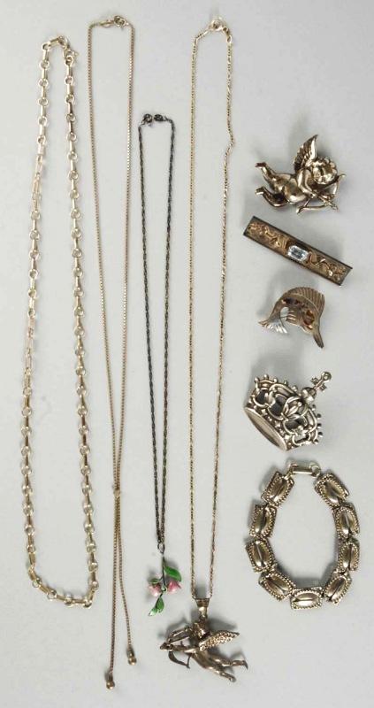 Lot of 9: Pieces of Sterling Silver Jewelry.: Includes sailfish, silver chain, bar with blue stone, large King's crown pin, bracelet, cherub shooting bow and arrow, and others. Size: