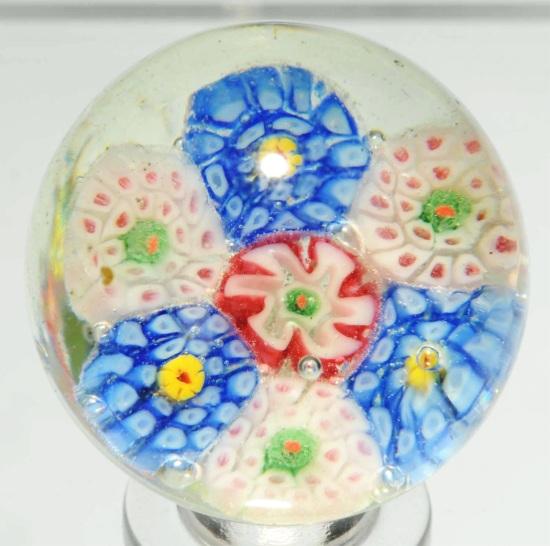 Millefiori Cane Paperweight Marble.: Great look in multiple colors. Marble is in fabulous condition. Hard-to-find size. Pinched and broken style pontil. Nice soft colors. Very small, slight under surface moon. Size: 1 - 1/8" Dia.