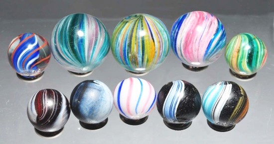 Lot of 10: Assorted Marbles.: This group includes eight handmade marbles consisting of two Indians, four onionskin, one clambroth, and one solid core. Lot also includes two machine made marbles. Size: Range: 5/8" to 15/16" Dia.