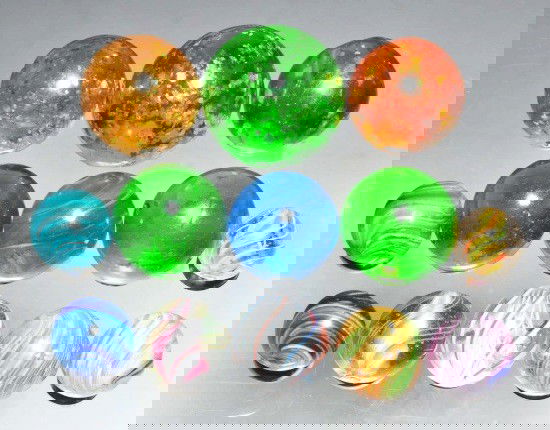 Lot of 13: Assorted Handmade Marbles.: Group includes micas, onionskins, three ground pontil transitions, one onionskin with mica, solid core swirls, and latticinos. Nice group of handmade marbles with good variety. Size: Range: 1/2" to 1
