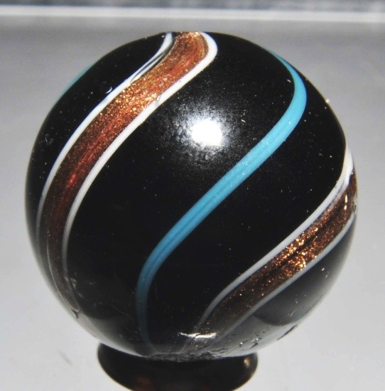 Black Opaque Lutz Marble.: Blue bands. Nice lutz banding throughout well crafted marbled. Has been polished and still shows minor imperfections. Size: 13/16" Dia.