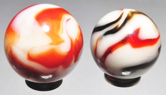 Lot of 2: Peltier Marbles.: Peltier Rebel marble has a minor flea bite. The opaque red and white National marble is slightly larger. Both marbles have great patterns. Size: 13/16" Dia. & 7/8" Dia.